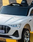 Audi Masinuta electrica pentru copii cu licenta E-Tron Sportback White cu telecomanda 2.4G acumulator 12V4.5Ahmotoare 80wlumini ledmuzicapornire la butonusi cu deschideremp3usbfunctie swing3 viteze din telecomanda