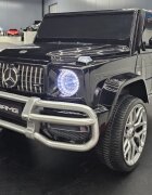 Cars4Kids Masinuta electrica pentru copii Mercedes G63 AMG Negru Metalic 24V 2 locuri licenta oficiala telecomanda 2.4G