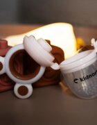 Kidnort Dispozitiv de hranire si jucarie de dentitie 2 in 1 Tannleke portabil sterilizabil fabricat din silicon medical + PU recomandat de la 4 luni Brown
