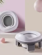 Kruzzel Olita de calatorie pliabila si portabila pentru copii 2 in 1 reductor toaleta recipient silicon picioruse antiderapante include 100 pungi si husa transport
