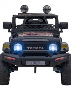 Toyota Masinuta electrica pentru copii FJ Cruiser 4x4 negru 90W cu telecomanda sunete suspensii lumini panou audio scaun piele si roti din spuma Eva