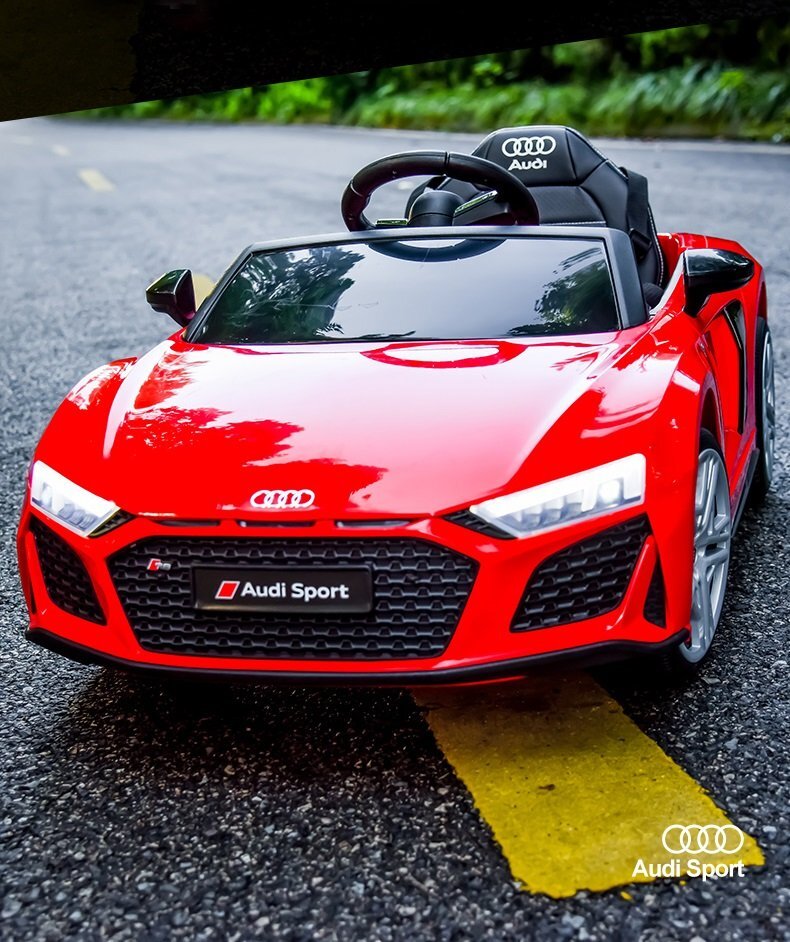 Audi Masinuta electrica copii R8 Red cu licentaacumulator 12V 78Wscaun din piele si roti EVA bluetooth display usi cu deschidere muzicaUSB lumini LED oglinzi retrovizoare pornire la butonsarcina maxima 30 kg