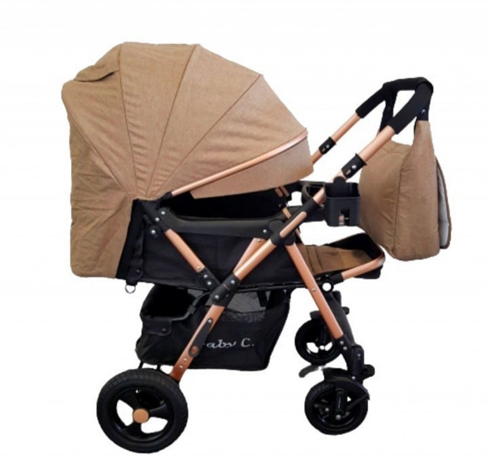 Baby Care Carucior pentru copii PRO 511 Maro Cu geanta bebe inclusa Cadru aluminiu Maner reversibil Spatar reglabil in 5 trepte Amortizoare Plasa insecte Frana picior Pliabil