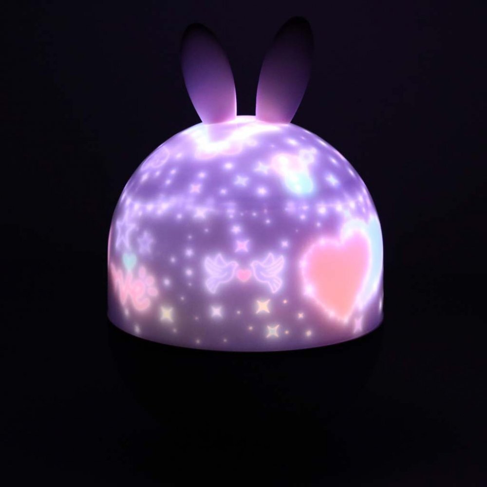 Ikonka Lampa de veghe pentru copii Rabbit dimensiune 12 x 16.5 cm rotativa cu telecomanda 6 melodii tematice lumina led si 6 seturi de folii interschimbabile