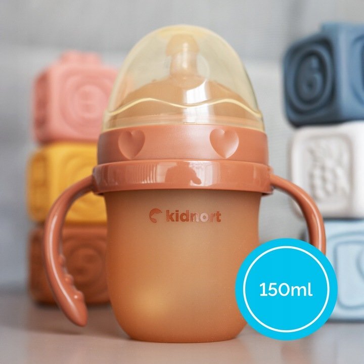 Kidnort Biberon anti-colici pentru bebelusi 0-3 luni Eple sterilizabil cu pai moale din silicon si biluta gravitationala incorporata maner ergonomic detasabil capacitate 150 ml Pink