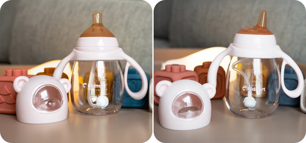 Kidnort Biberon cu tetina anti-colici debit variabil Jordbaer Pink 300 ml de la 6 luni echipat cu Pai cu bila gravitationala si maner ergonomic detasabil