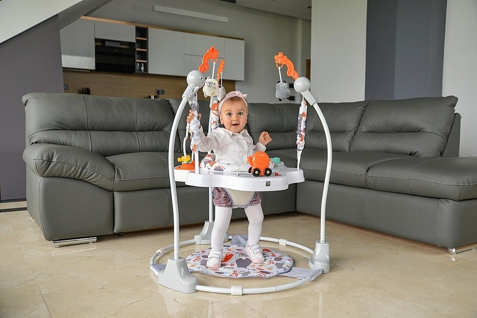 MONI Jumper pentru copii Magic fun Orange cu scaun rotativ 360inaltime reglabila pe 3 nivelepanou interactiv cu butoane muzicalejucarii din plusrecomandat de la 6luni si maxim 12 kg