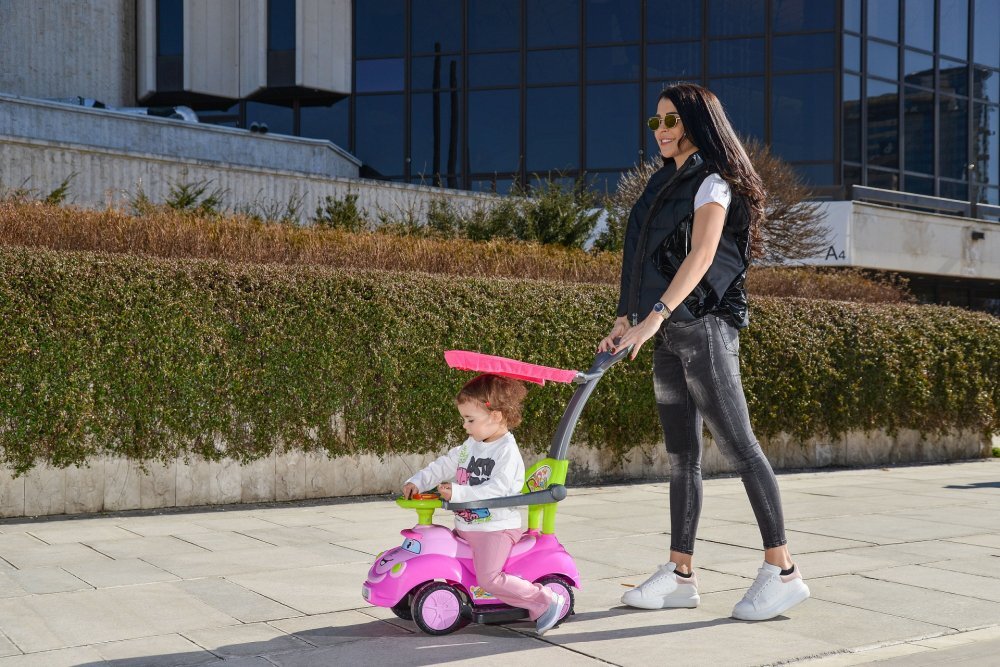 MONI Masinuta copii fara pedale Smile Pink 2 in 1 cu maner de impins pentru parinti suport pentru picioare bara de protectievolan cu lumini si melodii pana la 20 kg