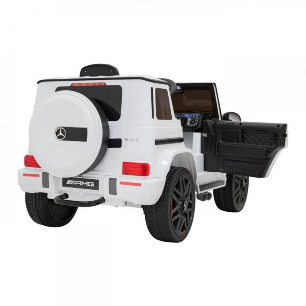 Novokids Masinuta electrica pentru copii Mercedes G63 AMG Alb roti din cauciuc Eva melodii si USB usi cu deschidere 12V 2 viteze lungime 120 cm 2 motoare de 25 W