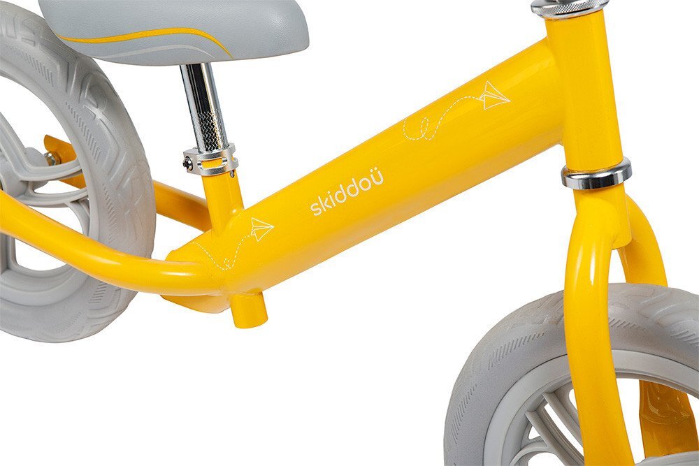 Skiddou Bicicleta fara pedale Nils Galben 12 inch cadru din aluminiu ultra-usoara scaun reglabil de la 33 la 39 cm roti spuma EVA+PU de la 2 ani include sonerie pentru bicicleta volan cu blocare prin rotire