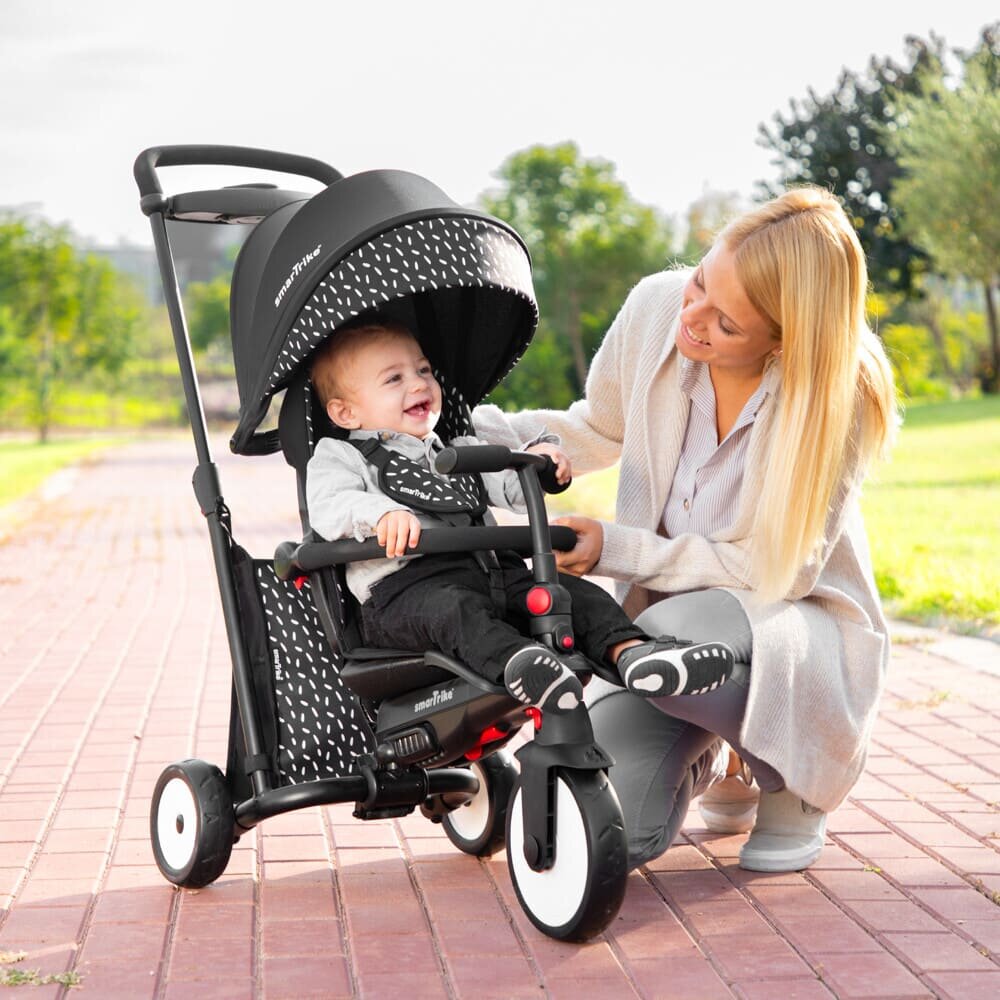SMART TRIKE Tricicleta pentru copii STR5 BlackWhite 7 in 1 ultrapliabila dotata cu frana scaun rabatabil de la 6 luni sistem patentat cu tehnologie Touch Steering