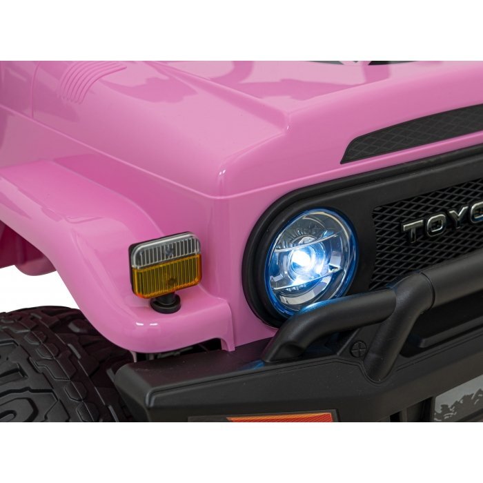 Toyota Masinuta electrica pentru copii FJ Cruiser 4x4 roz 90W cu telecomanda sunete suspensii lumini panou audio scaun piele si roti din spuma Eva