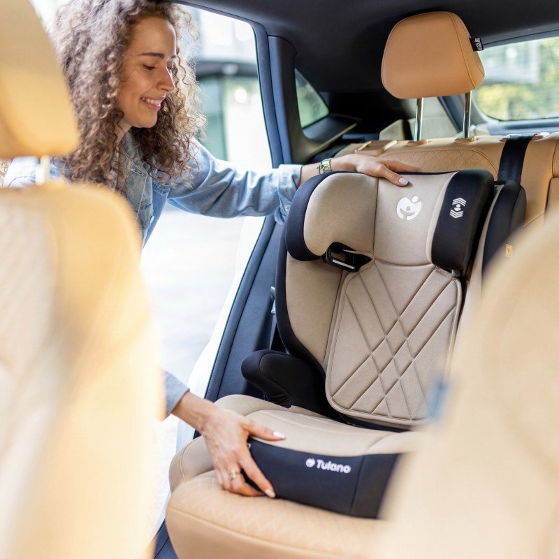 Tulano Scaun auto copii cu isofix 2in1 I-Size Joy 45 Beige 100-150 cm cu spatar detasabilcertificat ECE R129tetiera reglabila 14 pozitii sistem protectie impact lateral SIP2 parasolare auto incluse
